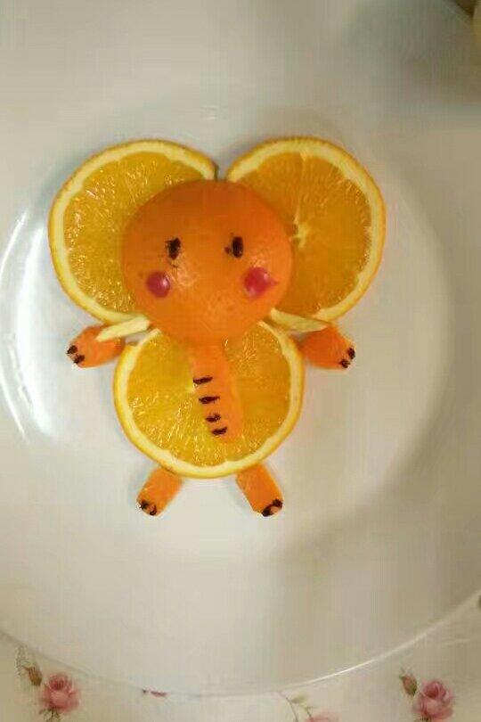 郑学美做的橙子水果拼盘直升机