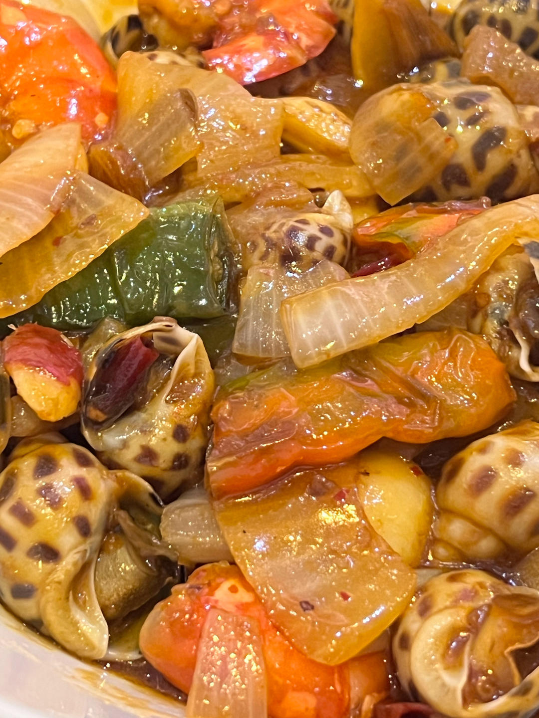 吮手指的辣炒花螺