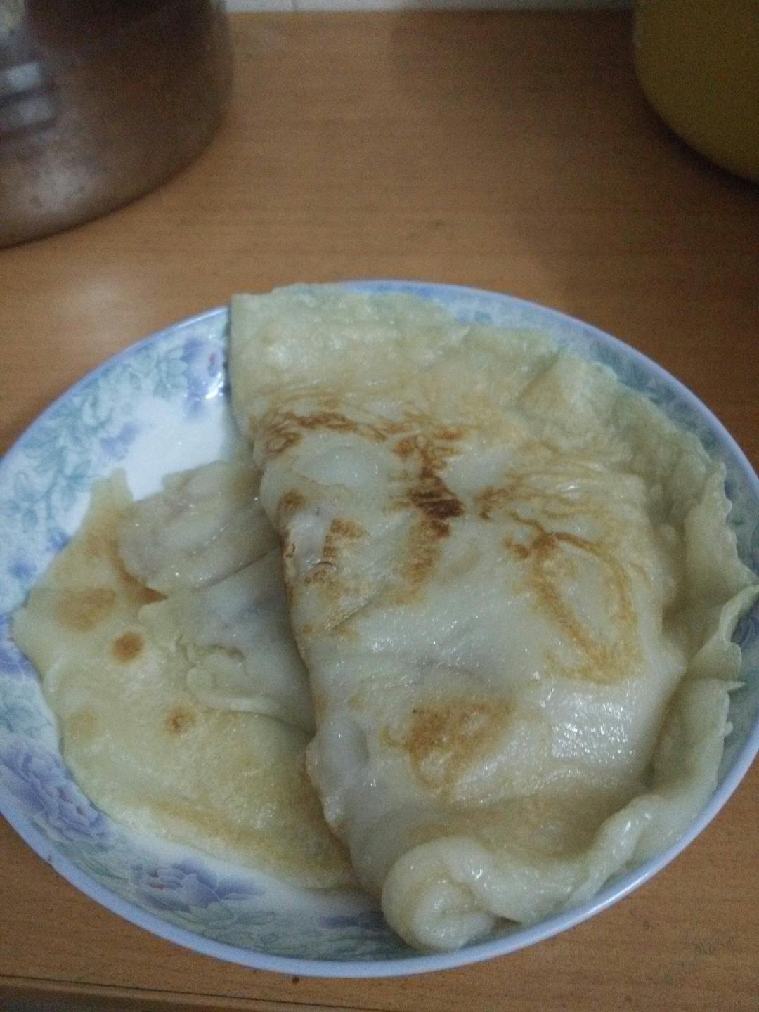 用料糯米煎饼的做法用容器加入适量糯米粉和适量白糖加水搅拌成糊状不