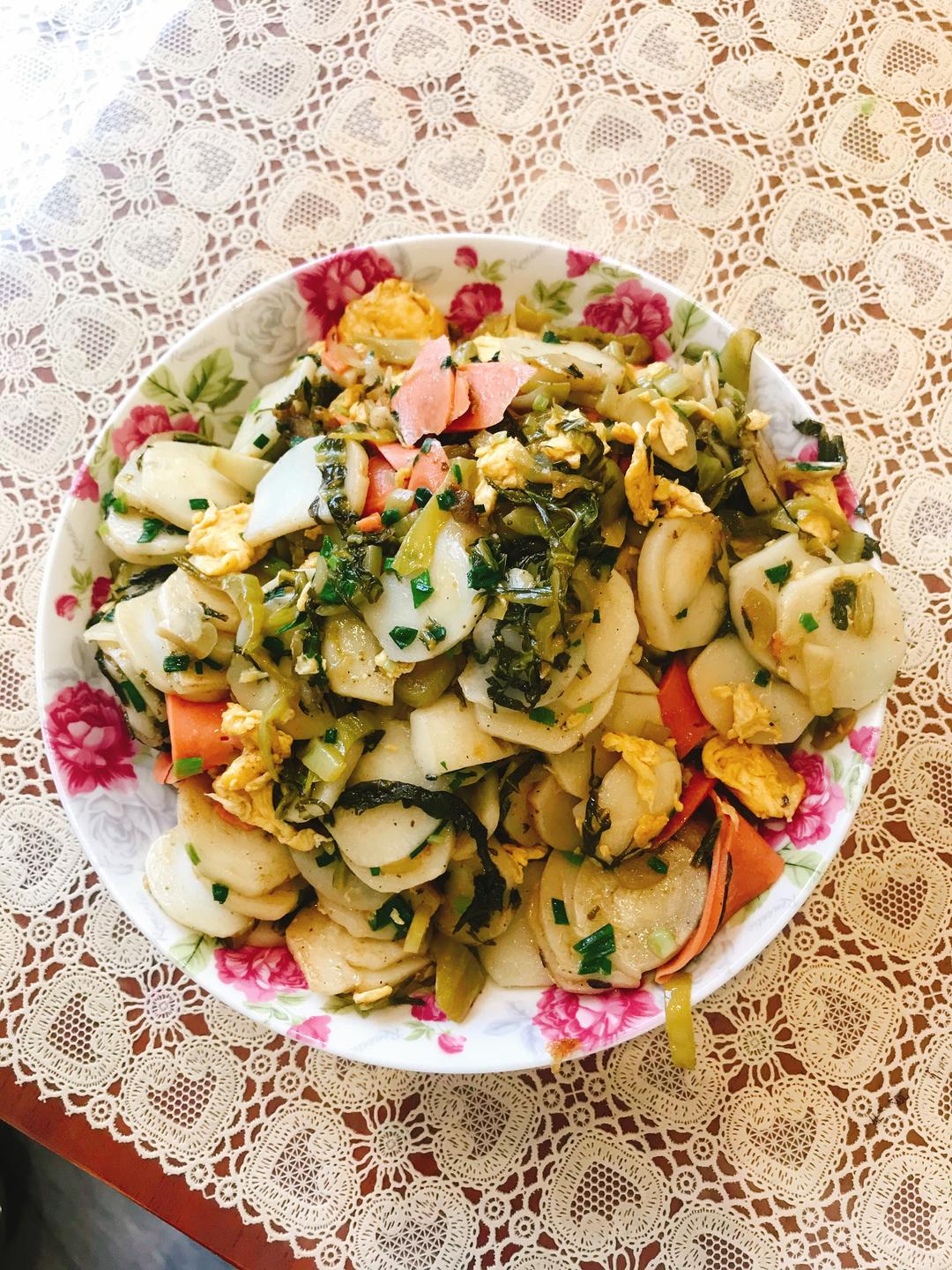 酸菜炒年糕的做法