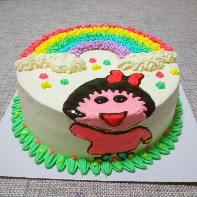 彩虹蛋糕下的小姑娘