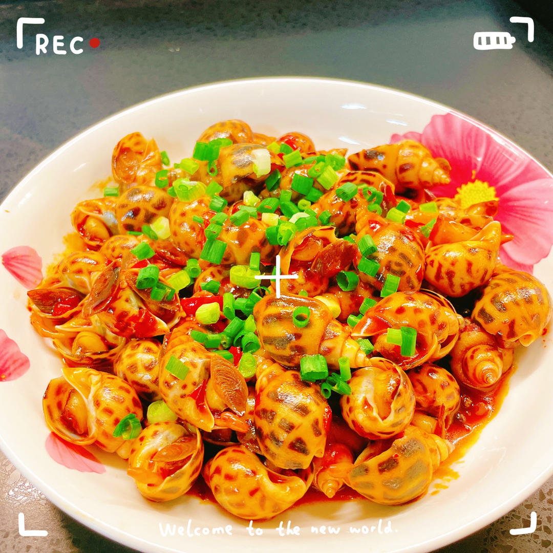 吮手指的辣炒花螺