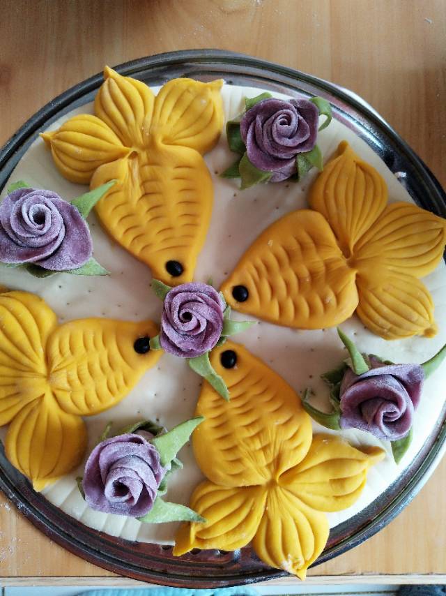 手机用户5854_0zn6做的南瓜紫薯花样馒头