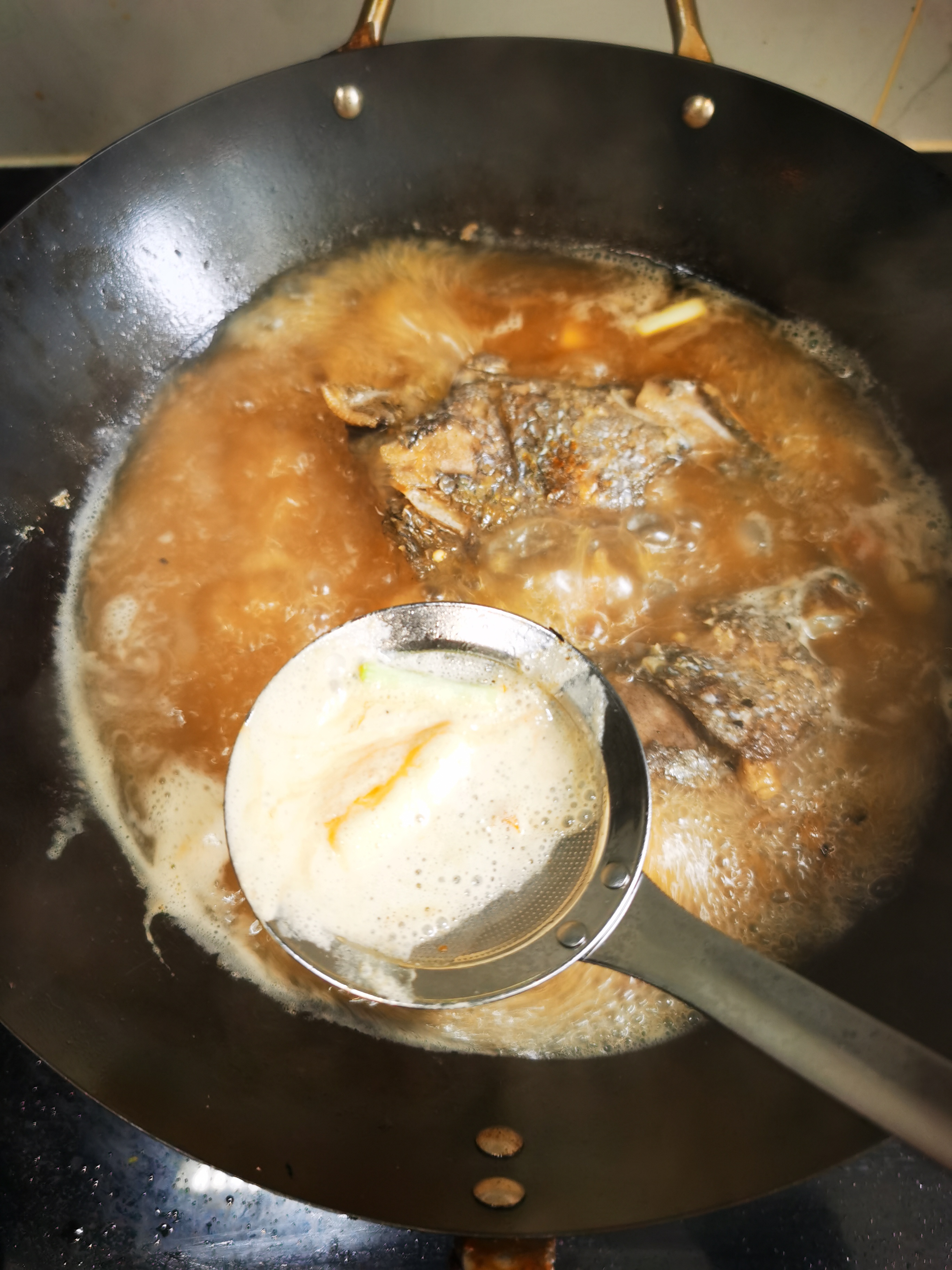 红烧鱼头豆腐汤的做法 步骤10